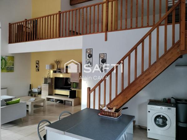 Appartement de 122m² avec mezzanine terrasse et parking dans une maison divisée en 2 logments