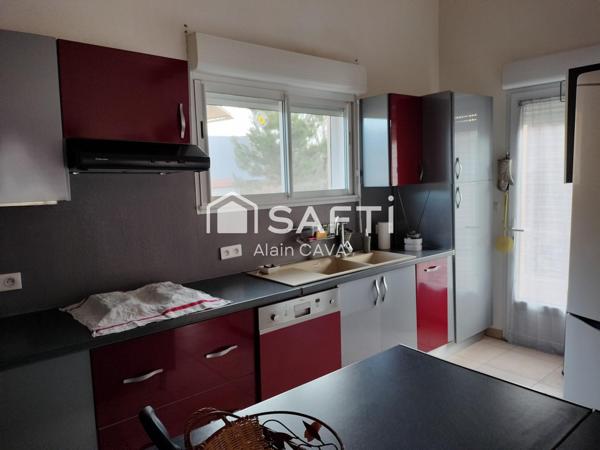 Appartement de 122m² avec mezzanine terrasse et parking dans une maison divisée en 2 logments