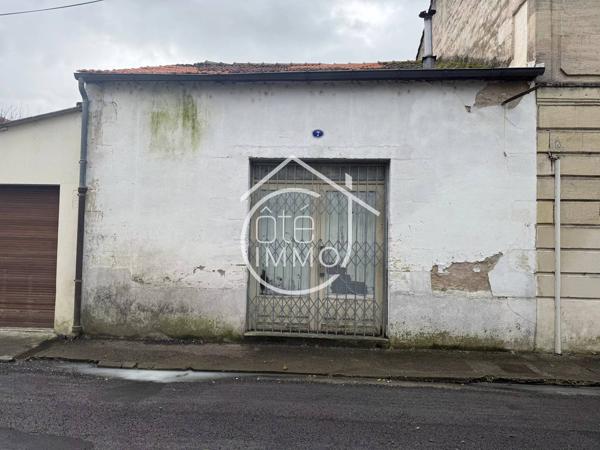 Sainte-Foy-la-Grande : Garage / Local à fort potentiel –