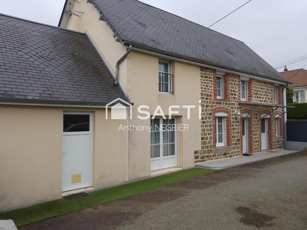 Maison avec garages et jardin