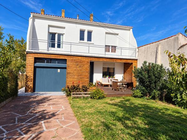 Maison individuelle avec jardin et garage proche centre-ville