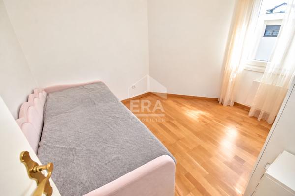 À VENDRE : appartement familial, 4 pièces, 117 m², 2 balcons, garage, cave.