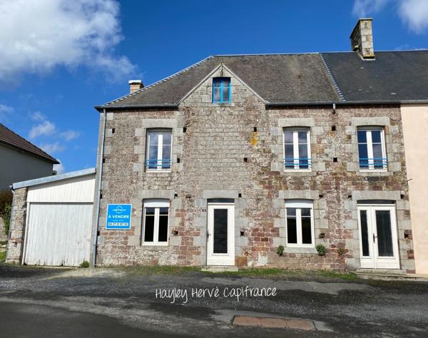 A vendre - Maison mitoyenne de 135 m² à finir à rénover avec jardin, garage et grenier, proche Saint Lo