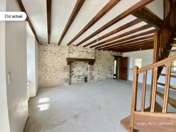 A vendre - Maison mitoyenne de 135 m² à finir à rénover avec jardin, garage et grenier, proche Saint Lo