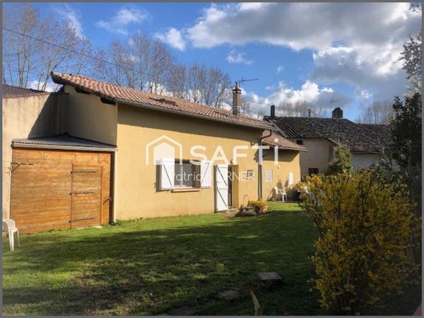 Maison de ville T5 avec garage, jardin et puits.