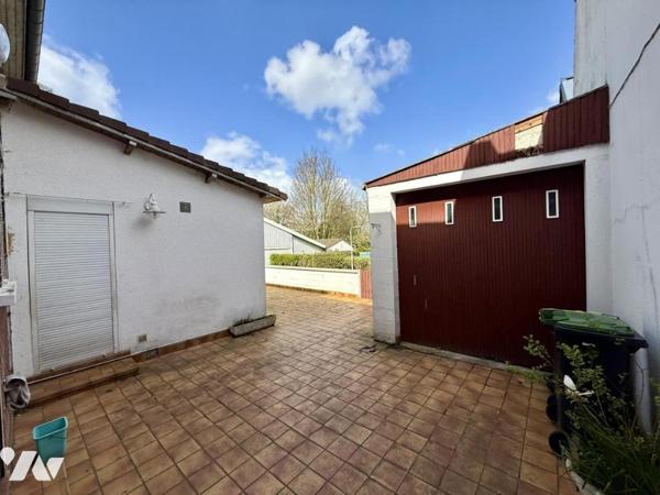 Maison de ville avec garage et jardin