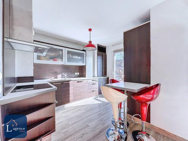 Appartement T4 traversant avec balcon et garage en plein centre de Sergy 01630