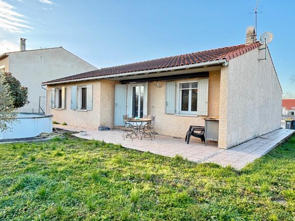 Maison plain-pied avec garage et jardin