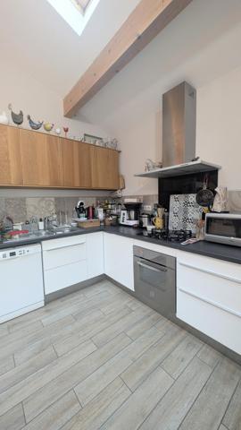 Appartement en rez de jardin avec cour privative