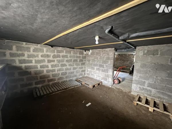 Grand appartement de plain-pied en centre bourg avec parking et cave