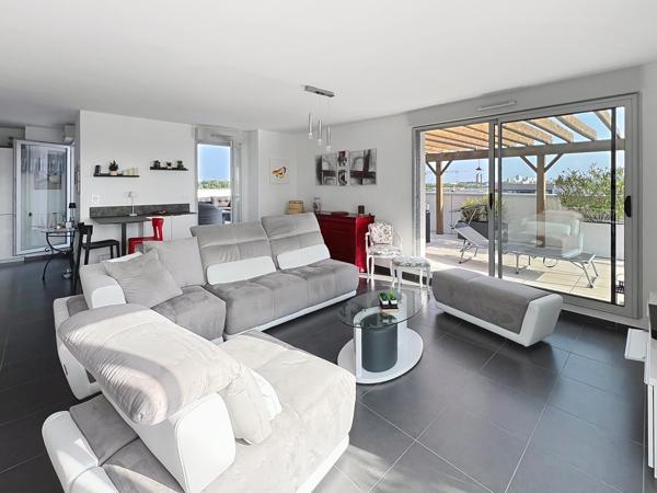 Élégance, confort et luminosité : découvrez ce superbe appartement avec grande terrasse au cœur de Bezannes.