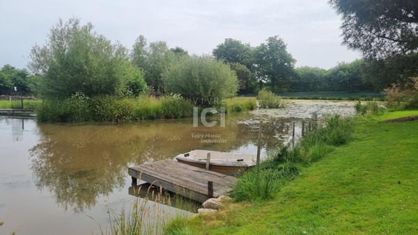 À Vendre - Plain-pied au calme, prolongé par une véranda toute saison