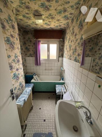 Maison 3 pièces (environ 60 m² habitables) située dans un secteur calme