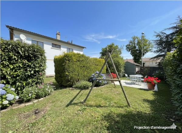 Maison avec jardin, garage et terrain constructible