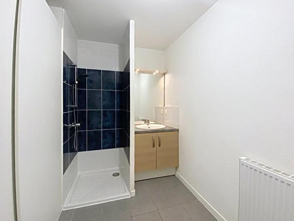 T2 en rez de jardin avec place de parking couverte