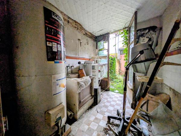 Immeuble à rénover avec beau potentiel