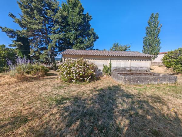 Maison de ville - Garage - Terrain 5000m2