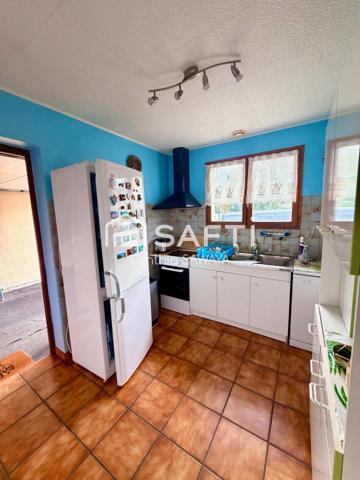 Belle maison à rafraîchir avec garage, terrasse couverte et cabanon
