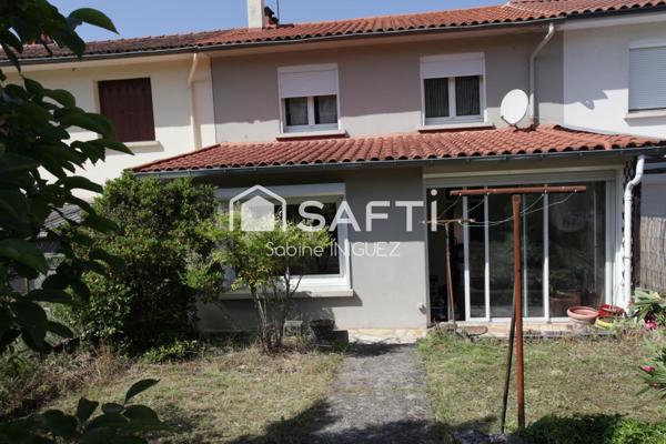 MAISON DE VILLE AVEC GARAGE ET JARDIN