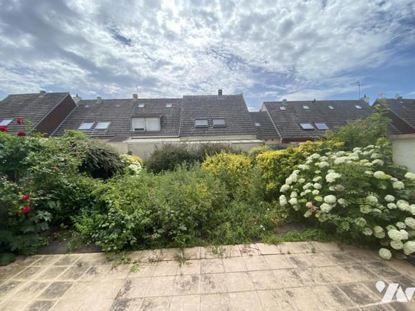Maison 6 pièces avec garage et jardin.