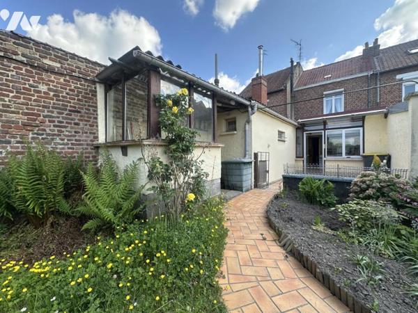 Centre-ville de La Bassée, maison d'environ 110m² avec jardin et garage