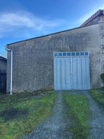 Maison de 75 m2 avec garage et jardin.
