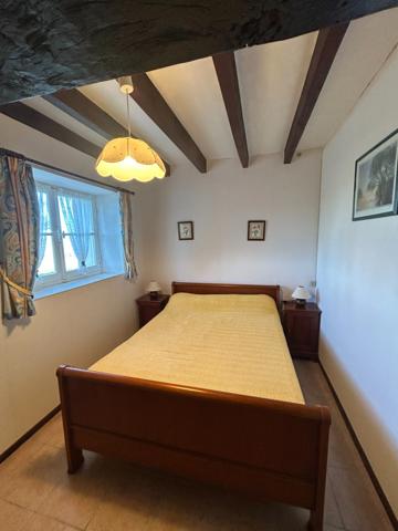 Maison de 75 m2 avec garage et jardin.