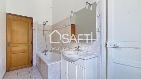 Immeuble de rapport de 189m² avec 2 appartements, un local commercial et une dépendance de 60m² sur 2 étages