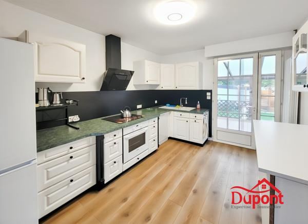 Maison individuelle avec 4 chambres, jardin et garage en sous-sol