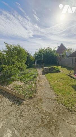 Maison avec garage et jardin 