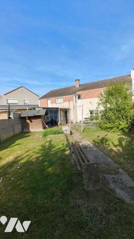 Maison avec garage et jardin 