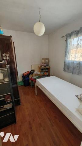 Maison avec garage et jardin 