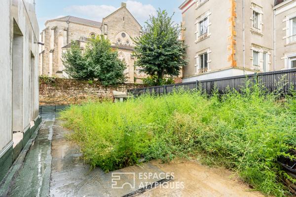Appartement en rez-de-jardin en plein centre ville