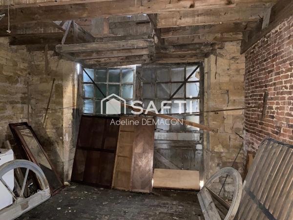 Bâtisse à rénover avec garages
