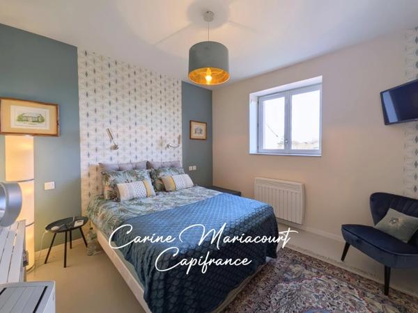 Maison de caractère de 226 m2, DPE B, 4 suites parentales, 2 garages, grande cave aménageable.