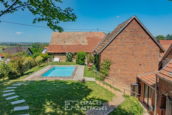 Propriété alsacienne réinterprétée avec piscine et vue