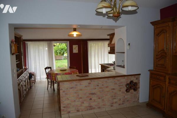 MAISON DE VILLE AVEC JARDIN ET GARAGE SITUEE SUR SECLIN