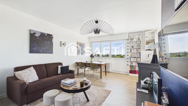 Bel appartement rénové avec balcon, cave et garage