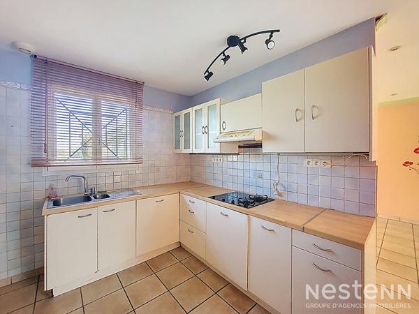 A Vendre Maison de 110 m² avec garage en sous-sol et jardin clôturé à Condom