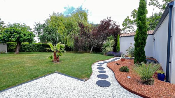 Maison de 62m2 à finir sur terrain arboré et paysagé