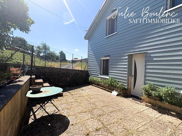 Charmante maison avec garage et jardin