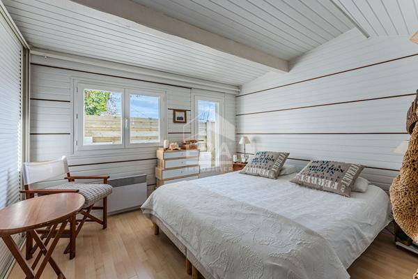 Maison bardage bois de 65 m². 2 chambres .garage .calme, jardin et terrasse