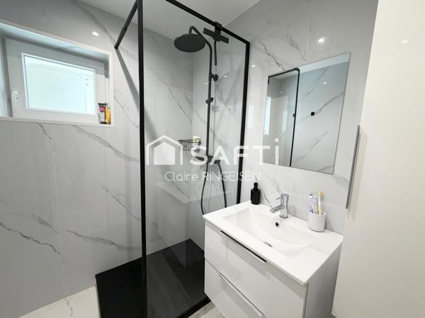 Appartement rénové de 87m² avec terasse, cave et garage