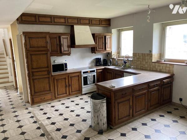 En centre ville maison traditionnelle sur terrain d'environ 1300 m²