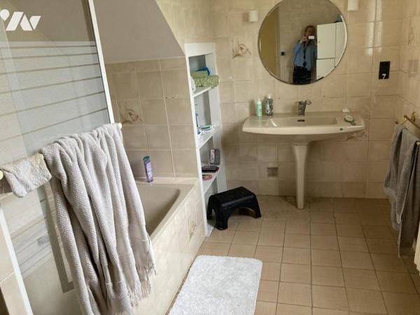 En centre ville maison traditionnelle sur terrain d'environ 1300 m²