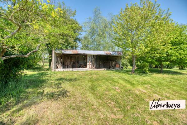 Maison T6 garage, annexes, terrain cadre exceptionnel.