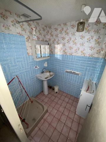 Maison ancienne composée de quatre appartements avec garages et dépendances