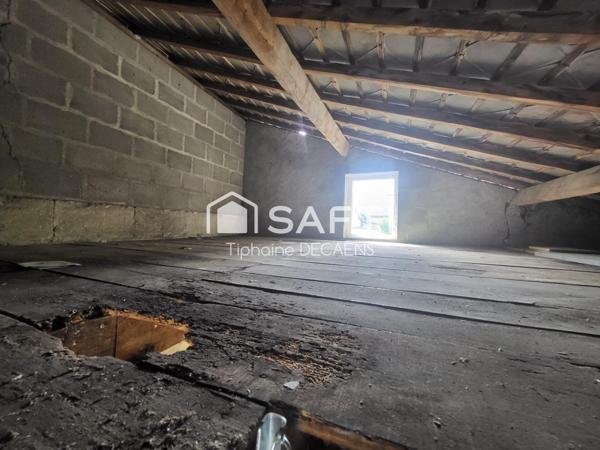 garage avec mezzanine, pouvant devenir un logement