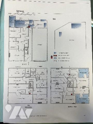 Un immeuble entier formant une seule unité foncière comprenant six logements et un grand garage