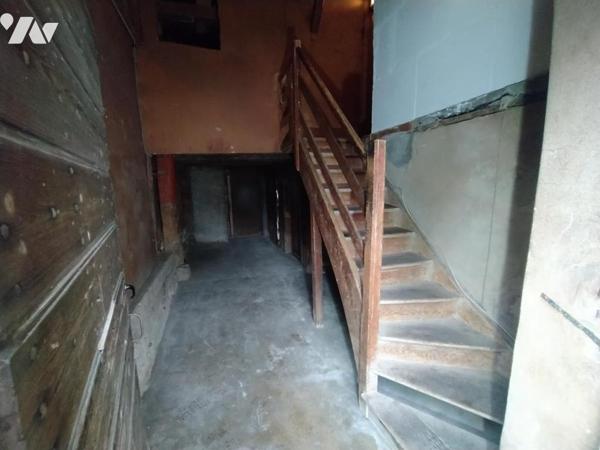 Immeuble mitoyen avec garages d'environ 250 m²